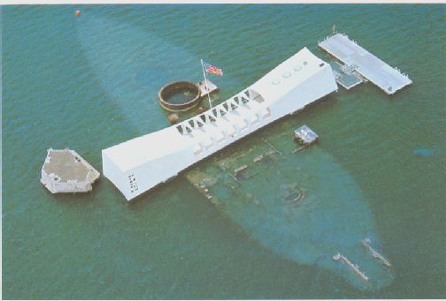 The Arizona memorial rests over the hull of the sunken battleship.