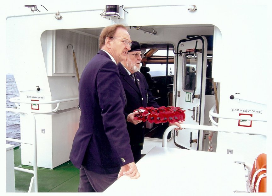 Brian with David Huges, Chairman of R.N.A. Orkney, laying a wreath on the Royal Oak.