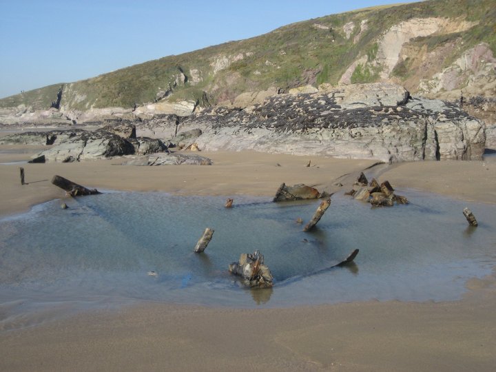 There is still quite a bit of wreckage buried deep in the sand.