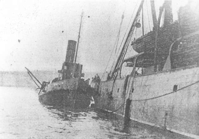 The Emilia with the tug Restorer. The Emilia with the tug Restorer.