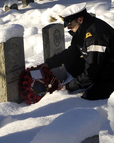 Alex at the grave of Captain Bernard Warburton-Lee. Photo Royal Navy.