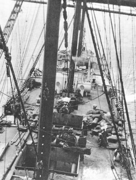 The rotting grain being removed from the wreck.