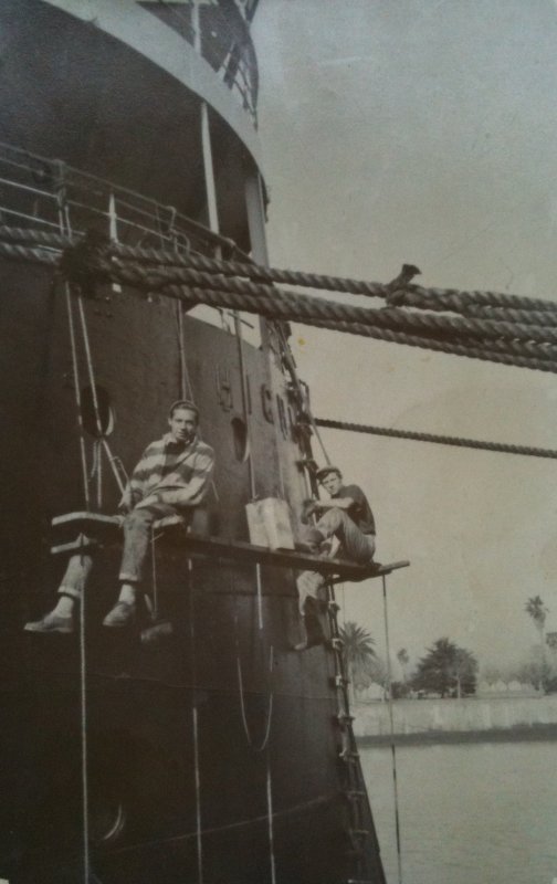 Crew members painting ship. Photo Craig Pearson