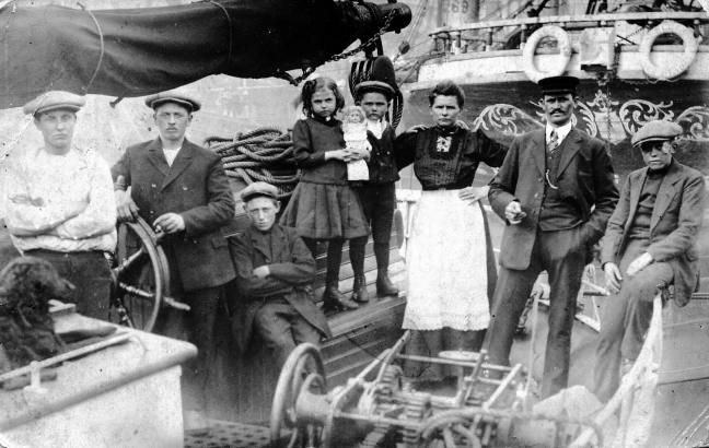 Photo of the crew. Chris verstappen's grandfather is on the right of the photo, and the dog is on the left. Both were saved.