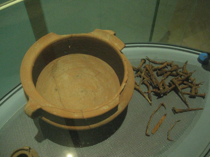 Cooking pot and nails found near the boat.