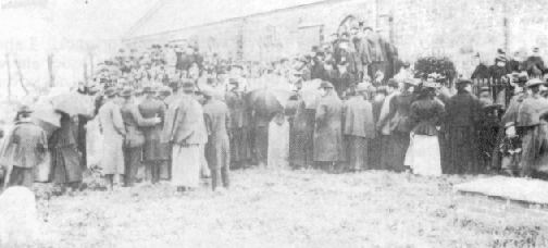 The interment of the victims in the mass grave.