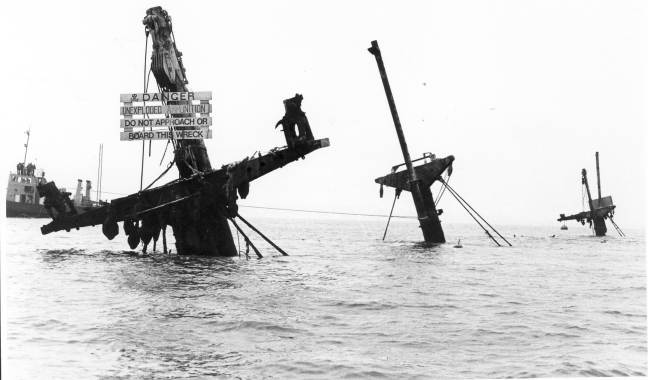 The wreck still sticks out of the water.