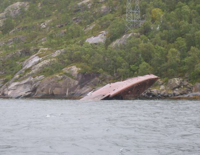 The wreck as it is today, bows stuck up in the air.