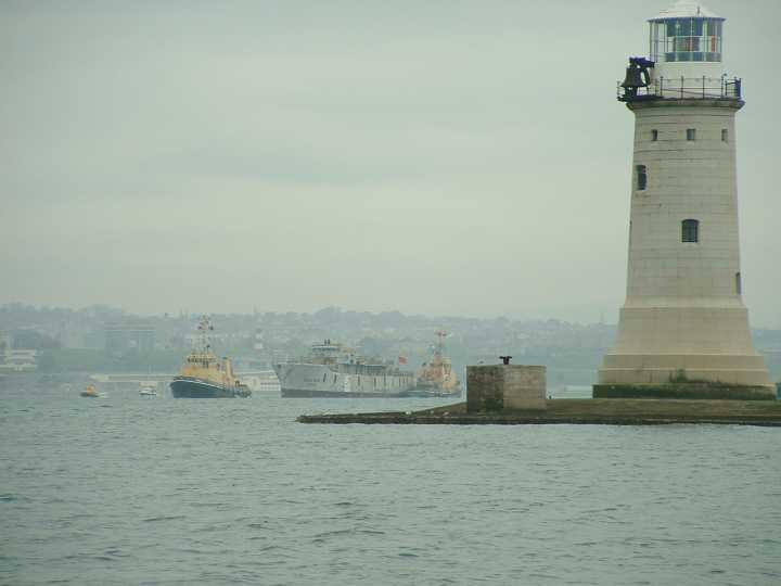 Scylla being towed past the Breakwater en-route to her final destination.