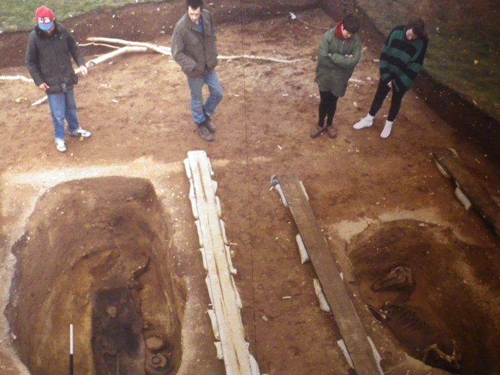 Grave with person and horse.