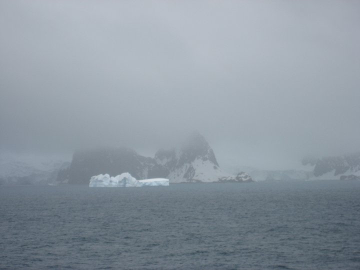 Half an hour later it started to snow, but there in the murk was Point Wild just to the right of the iceberg.